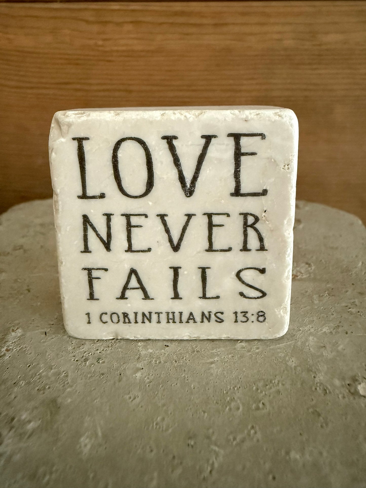 Scripture Stone Love Never Fails