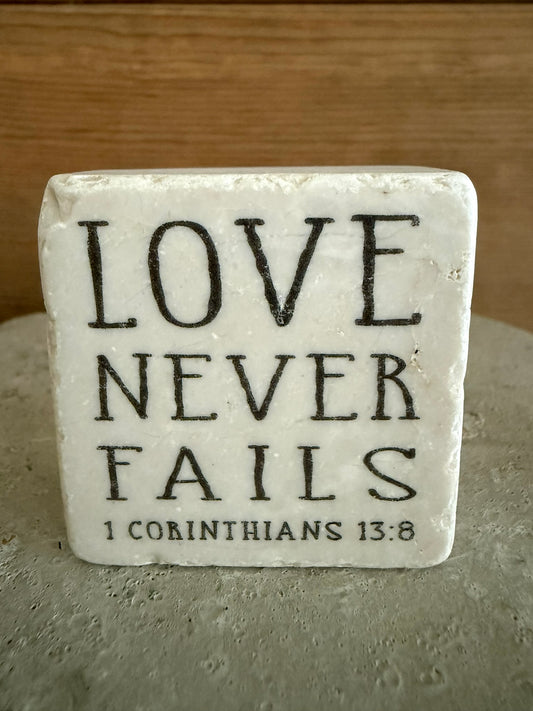 Scripture Stone Love Never Fails