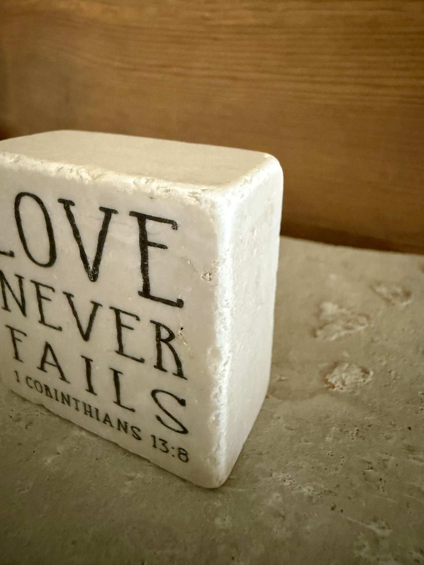 Scripture Stone Love Never Fails